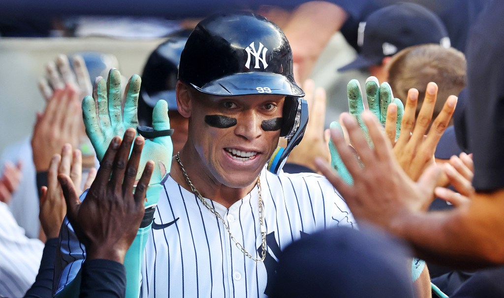 Aaron Judge celebrates after hitting a two-run homer in the first inning of the Yankees' 8-3 win over the Braves.