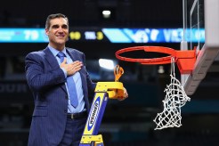 Jay Wright cuts down the net after Villanova's national championship win in 2018.