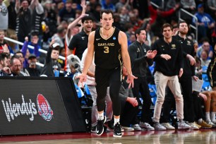 Jack Gohlke #3 of the Oakland Golden Grizzlies reacts after making a three pointer against the Kentucky Wildcats during the second half in the first round of the NCAA Men's Basketball Tournament at PPG PAINTS Arena on March 21, 2024 in Pittsburgh, Pennsylvania. 