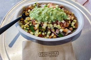 A bowl of food from Chipotle in Miami with a fork