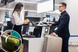 Passenger Weighing Luggage At Airport Check In.