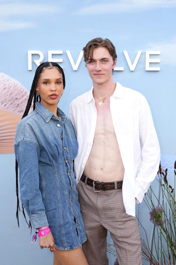 Lucky Blue Smith and Nara Aziza posing for a picture at REVOLVE Festival 2023, Thermal, California