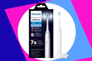 A white electric toothbrush in a box