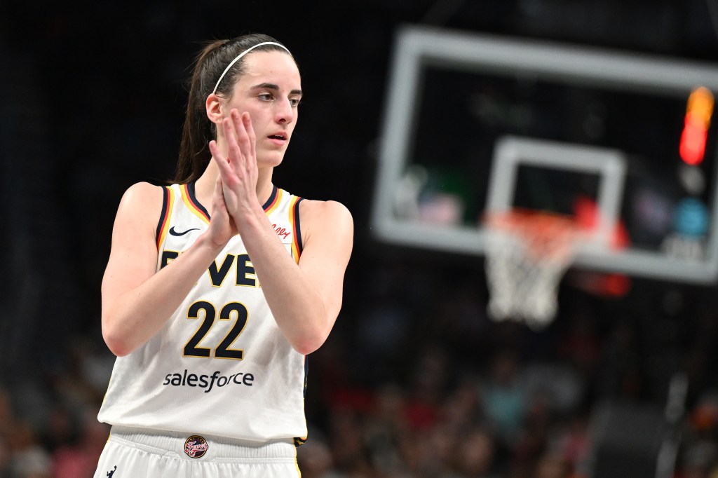 Caitlin Clark #22 of the Indiana Fever in her basketball uniform during a game against the Atlanta Dream at State Farm Arena