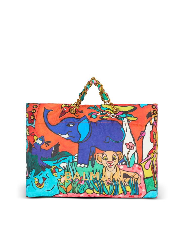 A colorful flat bag from the Disney X Balmain Lion King Collection