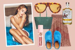 Rita Ora, actress and singer, sitting on a bed with her favorite Lanvin sunglasses and Goyard bag