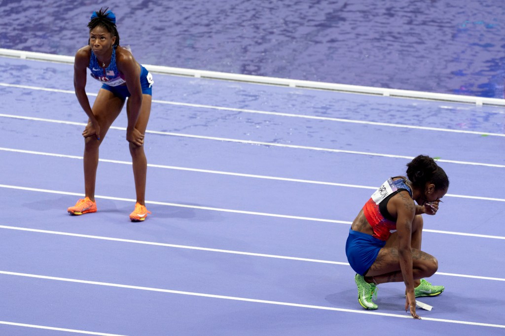 Sha'carri Richardson, right, and teammate Melissa Jefferson, both of the United States, wait for their results after the women's 100-meter final at the 2024 Summer Olympics, Saturday, Aug. 3, 2024.