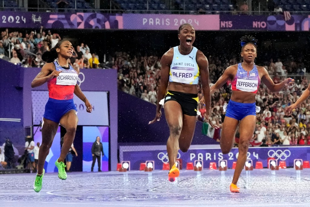 Sha'carri Richardson, of the United States, from left, Julien Alfred, of Saint Lucia, and Melissa Jefferson, of the United States, run in the women's 100-meter final at the 2024 Summer Olympics, Saturday, Aug. 3, 2024.