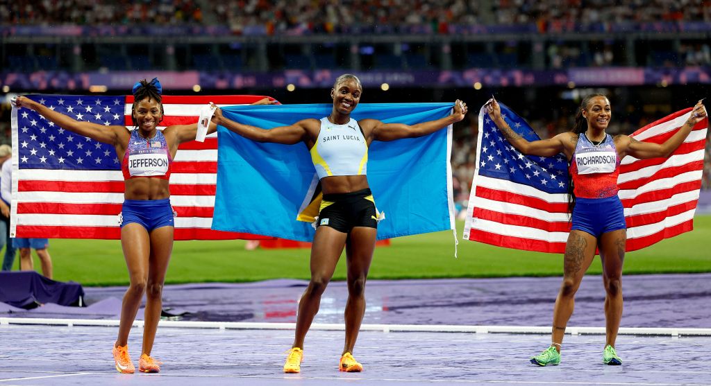 Third place Melissa Richardson, winner Julien Alfred of Saint Lucia and second placed Sha'carri Richardson of the USA celebrate after the Women 100m final.