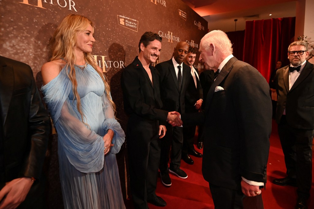 Britain's King Charles greets Pedro Pascal during the Royal Film Performance and Global Premiere of "Gladiator II" in Leicester Square in London, Britain on November 13, 2024.