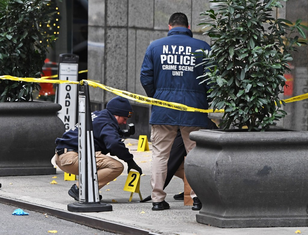 NYPD investigators at the murder scene.