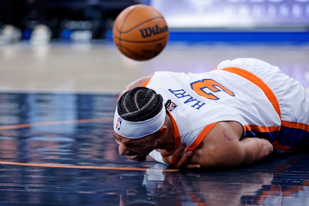 Josh Hart grabs his left shoulder after taking a hard fall during the Knicks' loss to the Timberwolves.