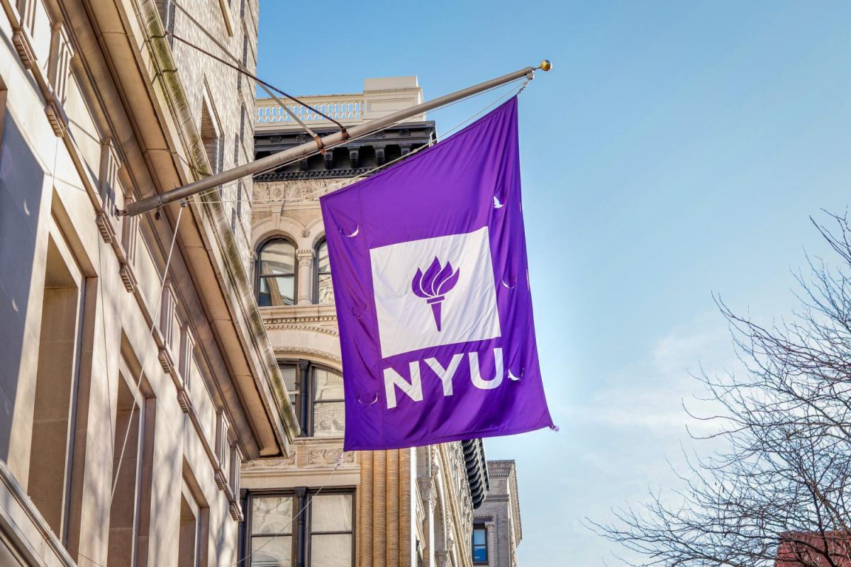 A purple flag with a white square and a purple torch inside, with white letters spelling N.Y.U. under the square.