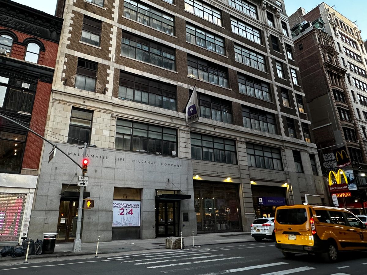 A photograph of a building from across the street.