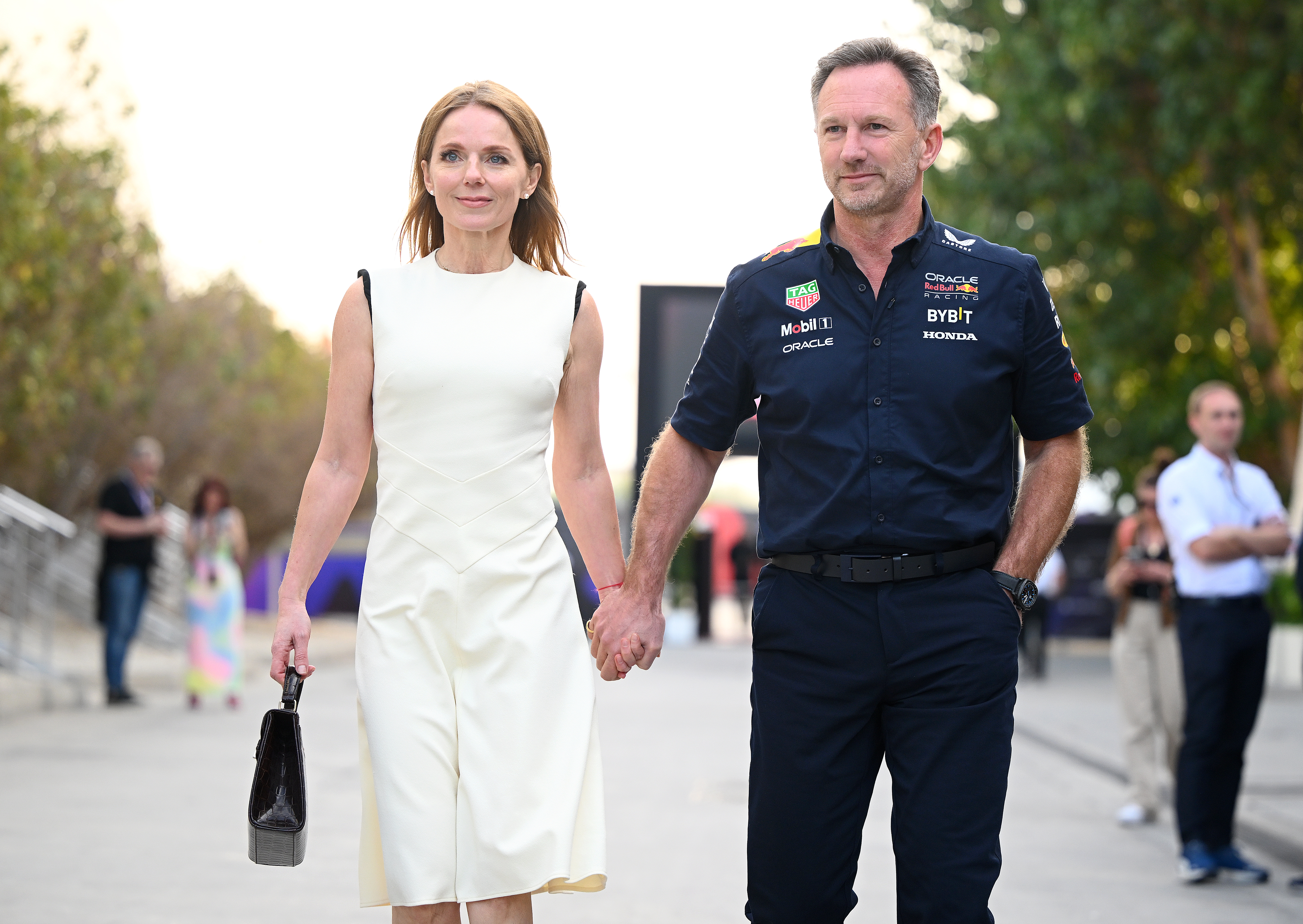 Geri Halliwell and Christian Horner holding hands.