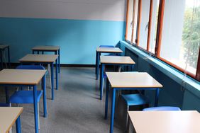 School desks in classroom.