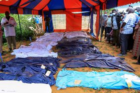 ody bags are laid out at the scene where dozens of bodies have been found in shallow graves in the village of Shakahola, near the coastal city of Malindi, in southern Kenya on April 24, 2023. The number of people who died in connection with KenyaÃ¢ÂÂs doomsday cult has crossed the 400 mark as detectives exhumed 12 more bodies on Monday, July 18, 2023, believed to be followers of a pastor who ordered them to fast to death in order to meet Jesus. Pastor Paul Mackenzie, who is linked to the cult based in a forested area in Malindi, coastal Kenya, is in police custody, along with 36 other suspects. All have yet to be charged. 