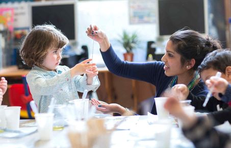 A young child participates in a science workshop