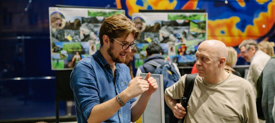 Researcher talking to an Imperial Lates attendee