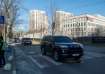 A convoy of cars leaves the U.S. embassy, amid Russia's attack on Ukraine, in Kyiv, Ukraine 