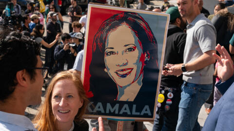 A supporter holds a sign as members of the San Francisco Democratic Party gather to support Kamala Harris, July 22, 2024, in San Francisco, California.