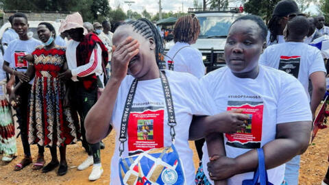 Agnes Cheptegei is assisted as she mourns her daughter and Olympian Rebecca Cheptegei at the Moi hospital funeral home, in Eldoret, Kenya, on September 13, 2024.