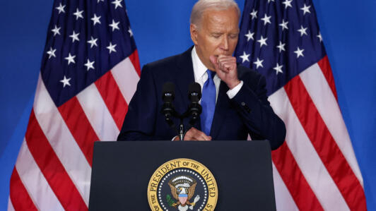 File photo of US President Joe Biden coughing at a press conference taken during NATO's 75th anniversary summit, in Washington, DC, July 11, 2024.