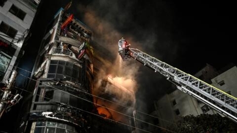 Firefighters work to extinguish a fire in a commercial building that killed at least 43 people, in Dhaka, on February 29, 2024.