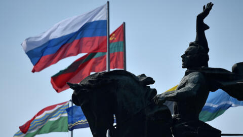 Flags of Russia and Transnistria which professes allegiance to Moscow flutter by a monument to 18th century Russian military commander Alexander Suvorovin in Tiraspol.