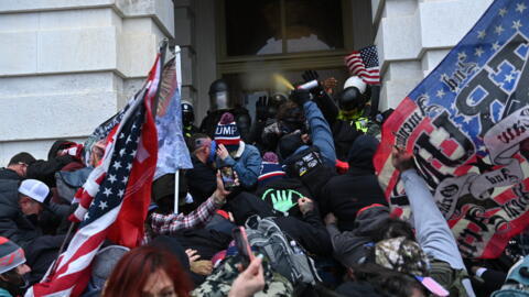 Supporters of then president Donald Trump clash with police and security forces as they storm the US Capitol in Washington on January 6, 2021.