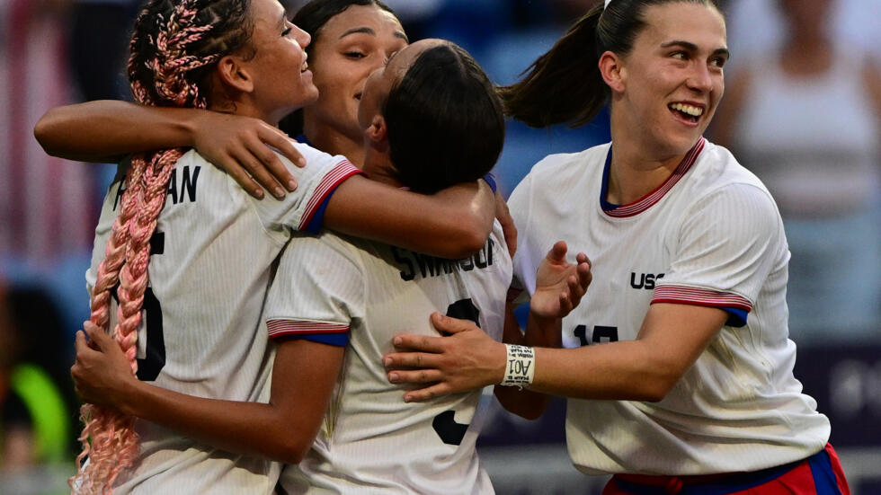 United States players celebrate after Sophia Smith struck the crucial goal in their Olympic women's football semi-final against Germany