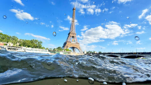 The Eiffel Tower is seen from the water of the Seine River on June 23, 2024.