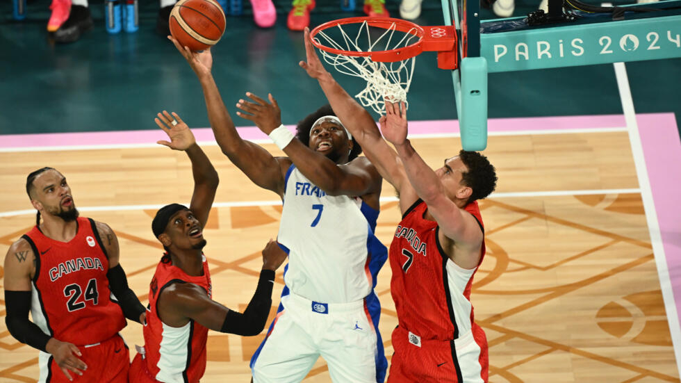 Guerschon Yabusele (2ndR) led France with a team-best 22 points in the win over Canada