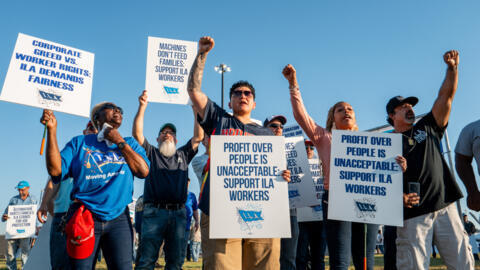 Dockworkers strike in a picket line outside of the Port of Houston Authority on October 01, 2024 in Houston, Texas.