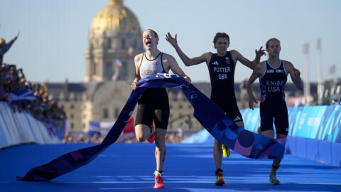 Germany's Laura Lindemann (left) celebrates after winning the gold medal ahead of bronze medalist Britain's Beth Potter (centre) and silver medalist Taylor Knibb of the United States in Paris.