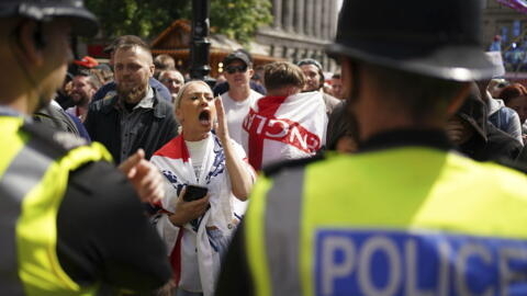 People protest in Liverpool, England on August 3, 2024, following the stabbing attacks on Monday in Southport, in which three young children were killed.