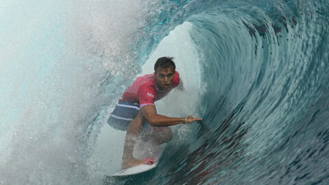 France's Kauli Vaast gets a barrel in the men's surfing gold medal final during the Paris 2024 Olympic Games in Teahupo'o, on the French Polynesian island of Tahiti, on August 5, 2024.