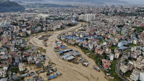 Bagmati River is seen flooded due to heavy rains in an aerial view of Nepal's capital, Kathmandu, on September 28, 2024.