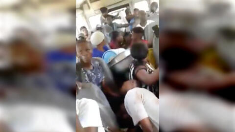 This is a screengrab of a video filmed in Port-au-Prince, Haiti on May 7, 2024 that shows the interior of a bus riddled with bullets. In the foreground, you can see a body. © X / @VelinaEC
