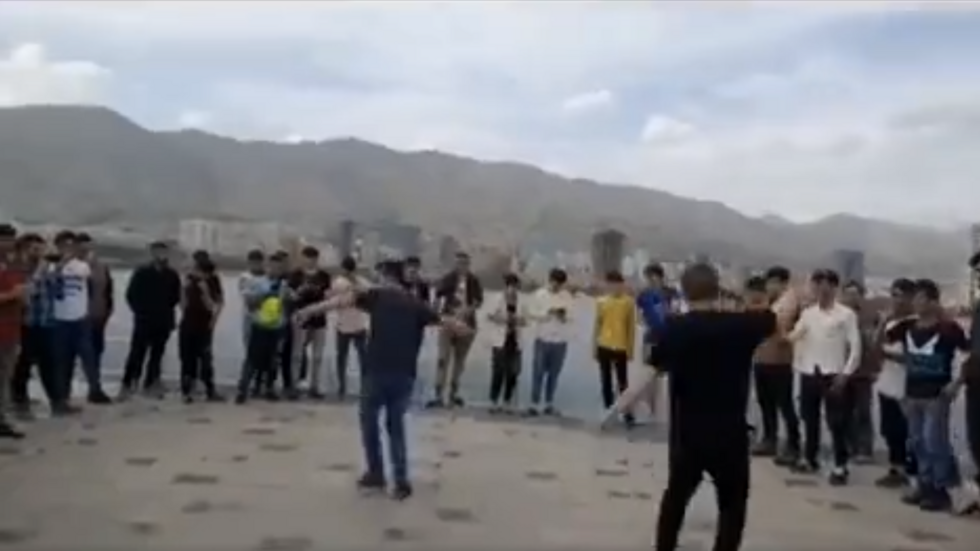 Groups of young Afghan immigrants regularly gather to dance and hang out on the shores of Lake Chitgar in the west of Tehran, Iran.