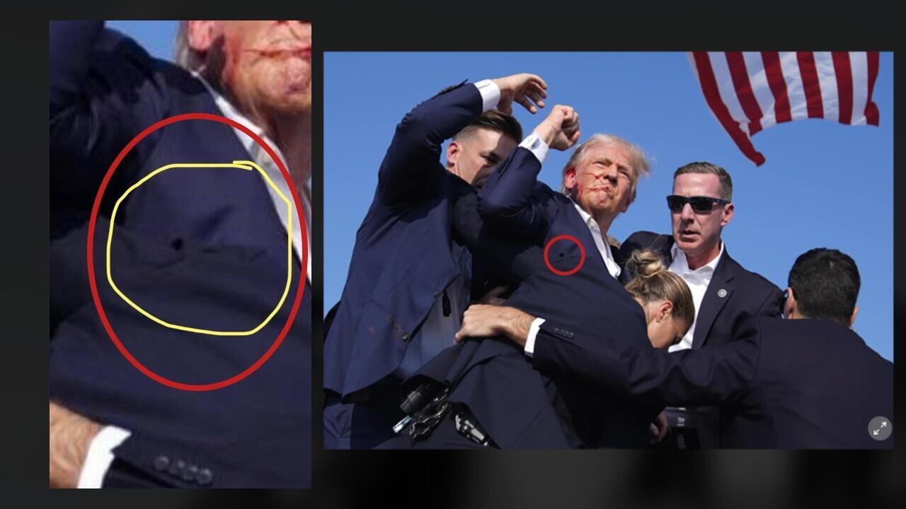 Here, we’ve compared the photo that has been circulating online (at left) which makes it look like Trump was shot in the chest, with the original photo (at right) taken by Evan Vucci for the AP. What at first looks like a hole is actually the shadow in a fold in the jacket worn by the Secret Service agent with a ponytail who has put her arms around the candidate to protect him.