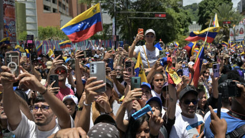 Opponents of Venezuelan President Nicolas Maduro gather for a demonstration called by opposition leader Maria Corina Machado over the presidential election disputed results, in Caracas on 3 August, 2024. 