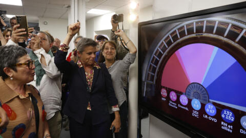 Supporters of Les Ecologistes (The Ecologists - Greens) party and the alliance of left-wing parties, called the "Nouveau Front Populaire" (New Popular Front - NFP), react after partial results in the