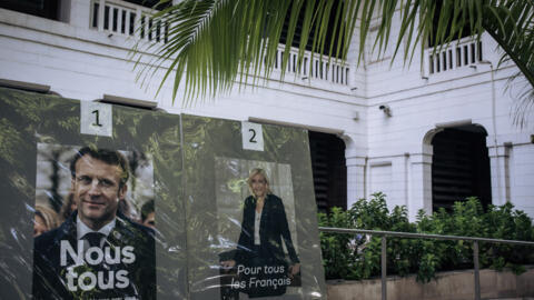 Posters of election candidates incumbent French President Emmanuel Macron and his far-right challenger Marine Le Pen at the French Embassy in Kinshasa, Democratic Republic of Congo, on 24 April 2022.