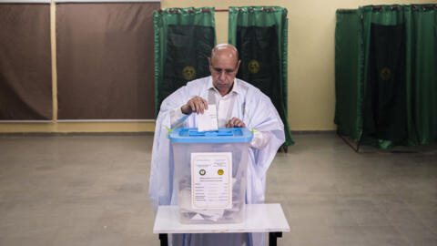 Incumbent Mauritanian President Mohamed Ould Ghazouani casts his ballot at a polling station in Nouakchott on 29 June 2024.