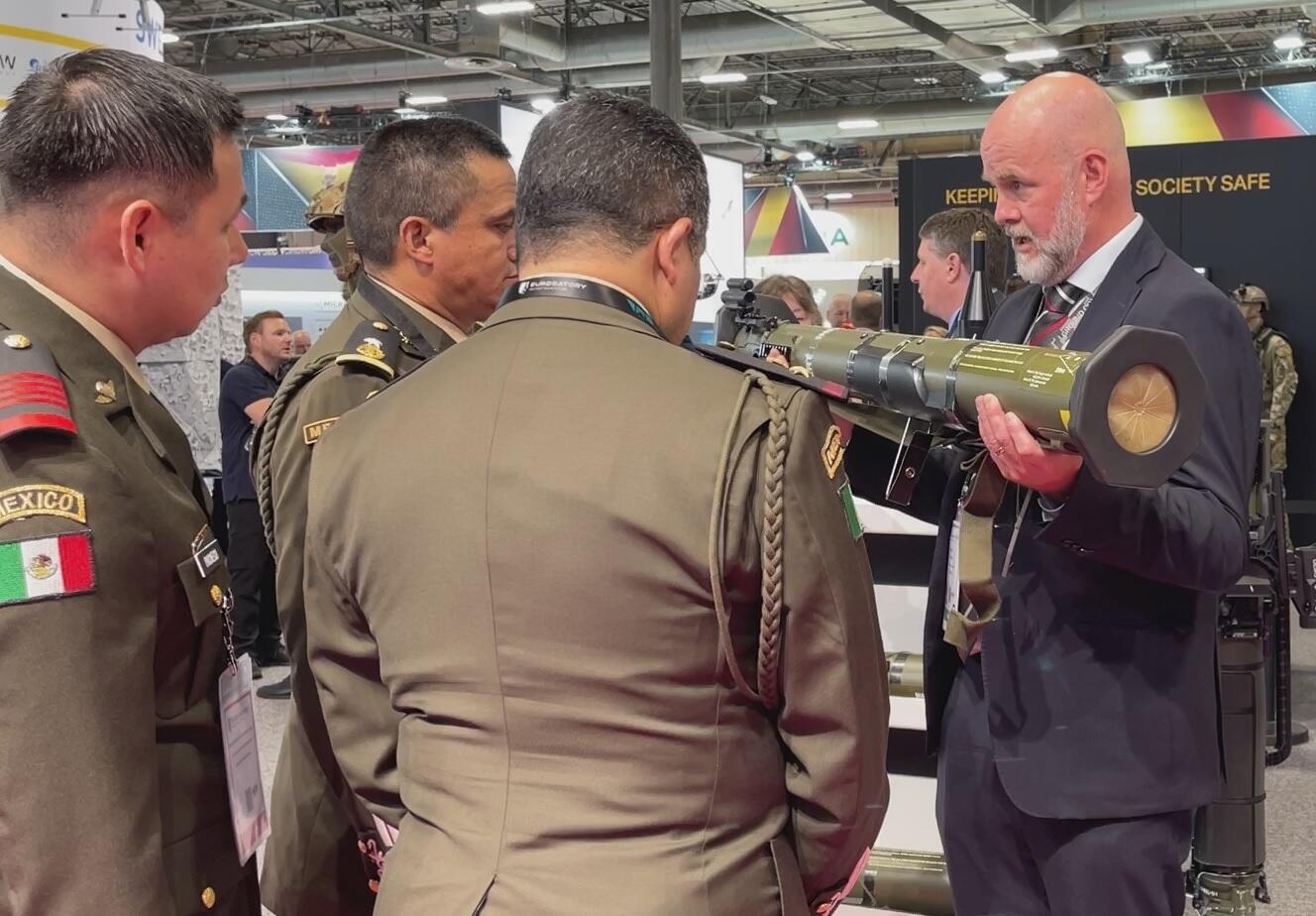 Salesperson showing an anti-tank weapon to a military delegation from Mexico, Eurosatory 2024, Villepinte, 18 June 2024.