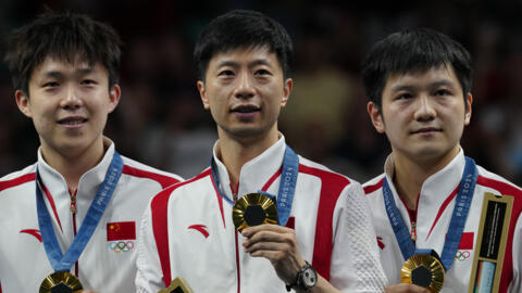 Chunqin Wang (left)  Long Ma (centre) and Zhendong Fan beat the Sweden team on 9 August to win the Olympic men's team table tennis tournament.