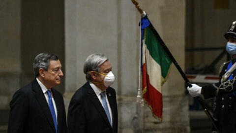 Italy's Prime Minister, Mario Draghi (L) greets United Nations Secretary-General Antonio Guterres upon his arrival for their meeting at the Chigi palace in Rome on October 29, 2021, ahead of an upcoming G20 summit of world leaders.