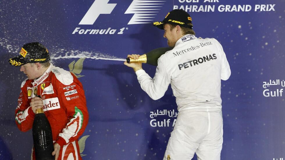 Mercedes driver Nico Rosberg (right) and Ferrari driver Kimi Raikkonen of Finland celebrate after winning the Bahrain GP.