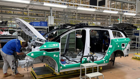 Employees work on an electric vehicle (EV) production line during an organised media tour to a factory under Jiangling Group Electric Vehicle (JMEV), in Nanchang, Jiangxi province, China May 22, 2024.